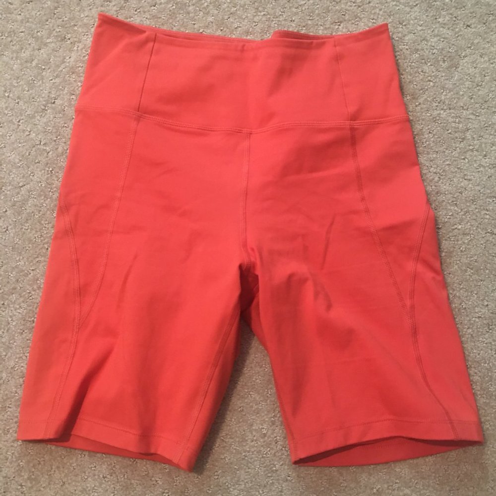 girlfriend collective high-rise bike shorts (coral)